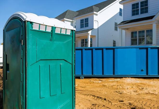 workers at a work site take advantage of convenient portable toilets